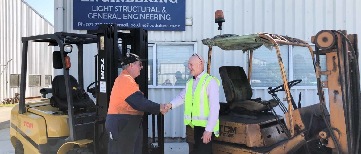 Steve from ITS Forklifts shaking hands with Richard from Bowline Engineering having TCM new and old forklifts on background